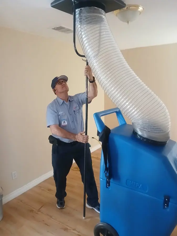 HVAC Installation technician using HEPA equipment in Gray